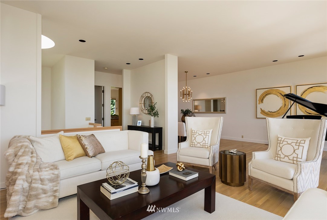 104 Highland Drive Seattle, WA 98109 - Photo 13 of 39 a living room with furniture a rug and a couch