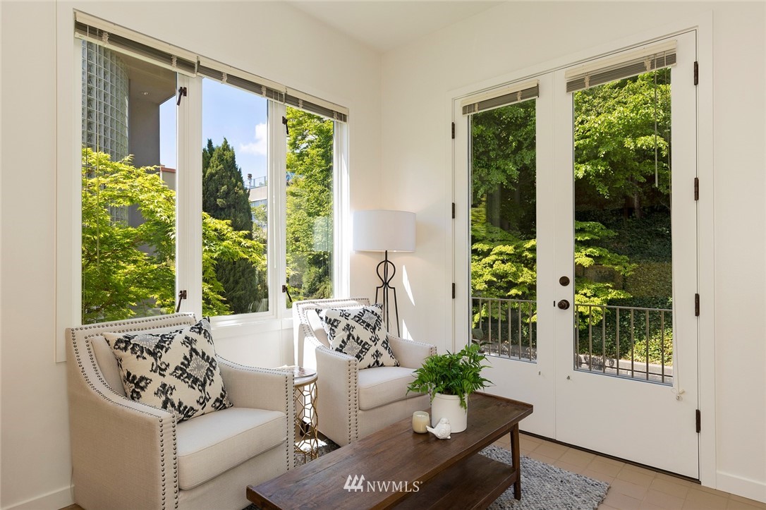 104 Highland Drive Seattle, WA 98109 - Photo 17 of 39 a living room with furniture and a potted plant