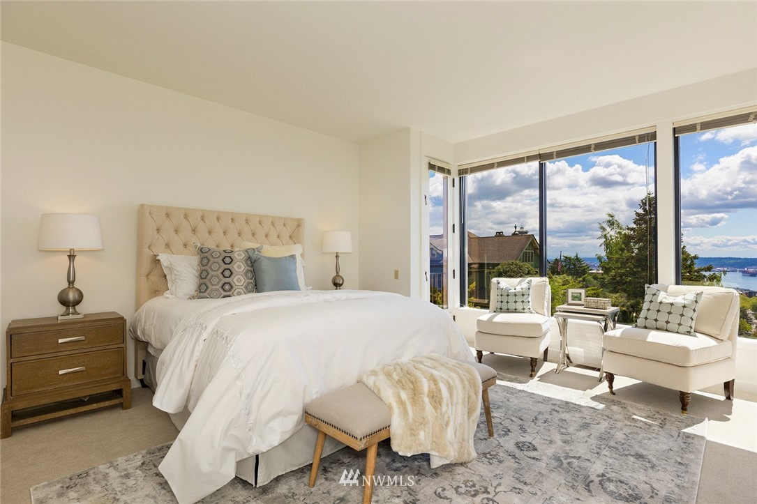 104 Highland Drive Seattle, WA 98109 - Photo 21 of 39 a bedroom with a bed and large windows
