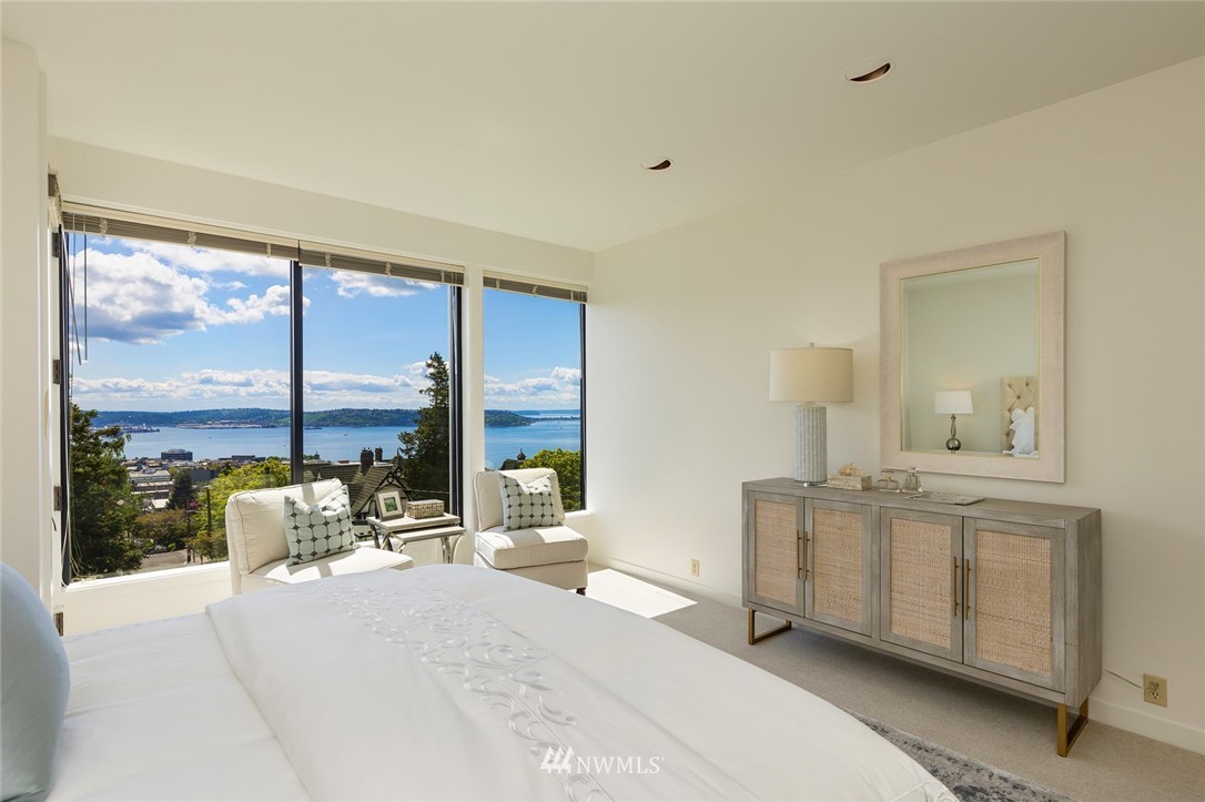 104 Highland Drive Seattle, WA 98109 - Photo 22 of 39 a dining room with furniture and a floor to ceiling window