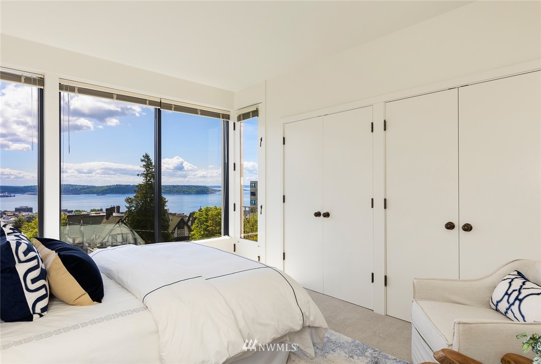 104 Highland Drive Seattle, WA 98109 - Photo 26 of 39 a bedroom with a bed and a large window