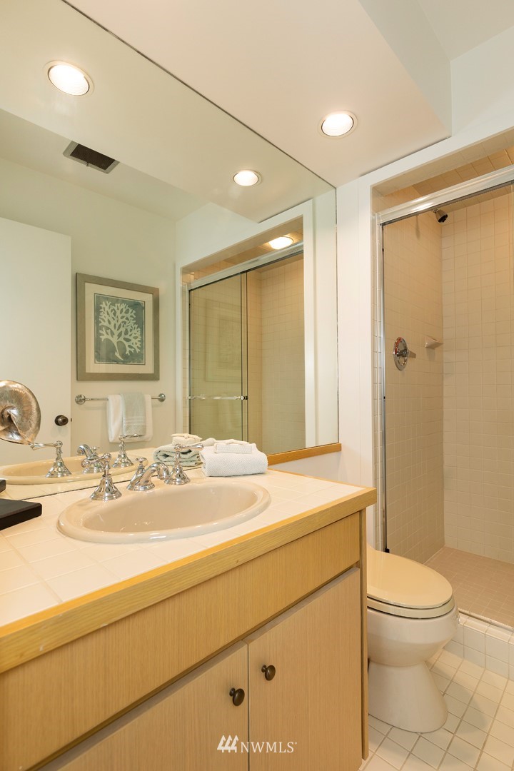 104 Highland Drive Seattle, WA 98109 - Photo 27 of 39 a bathroom with a sink a toilet and shower