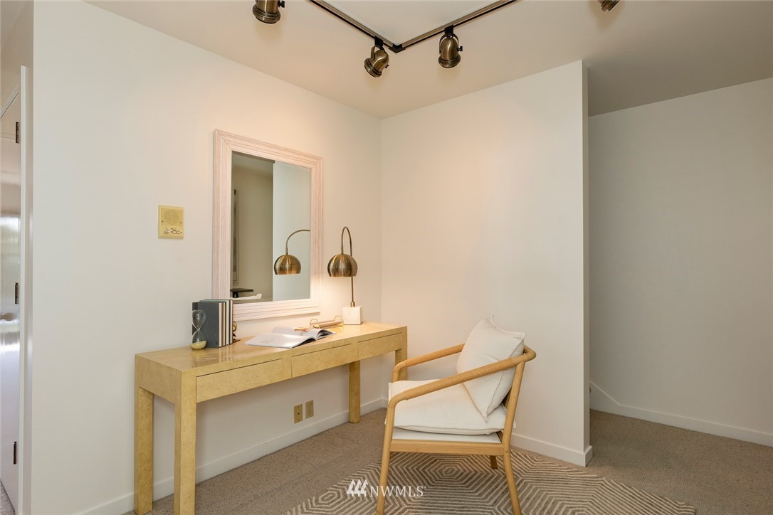 104 Highland Drive Seattle, WA 98109 - Photo 31 of 39 a bathroom with a sink mirror and a toilet