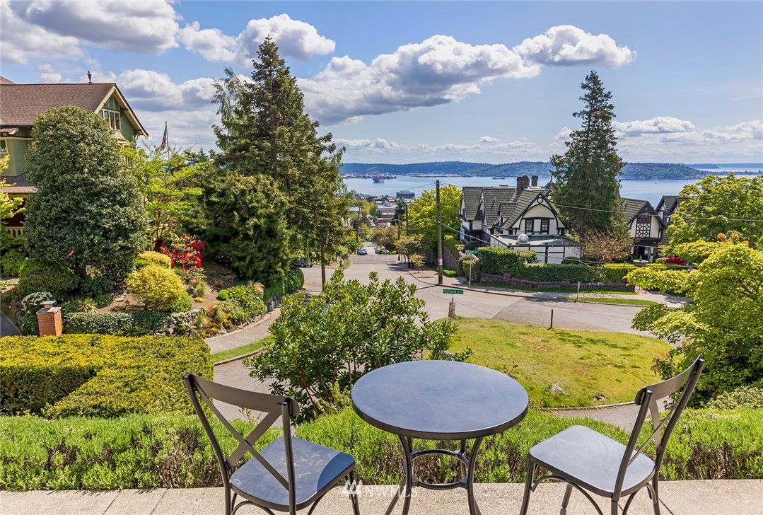 104 Highland Drive Seattle, WA 98109 - Photo 34 of 39 a view of a swimming pool with a table and chairs