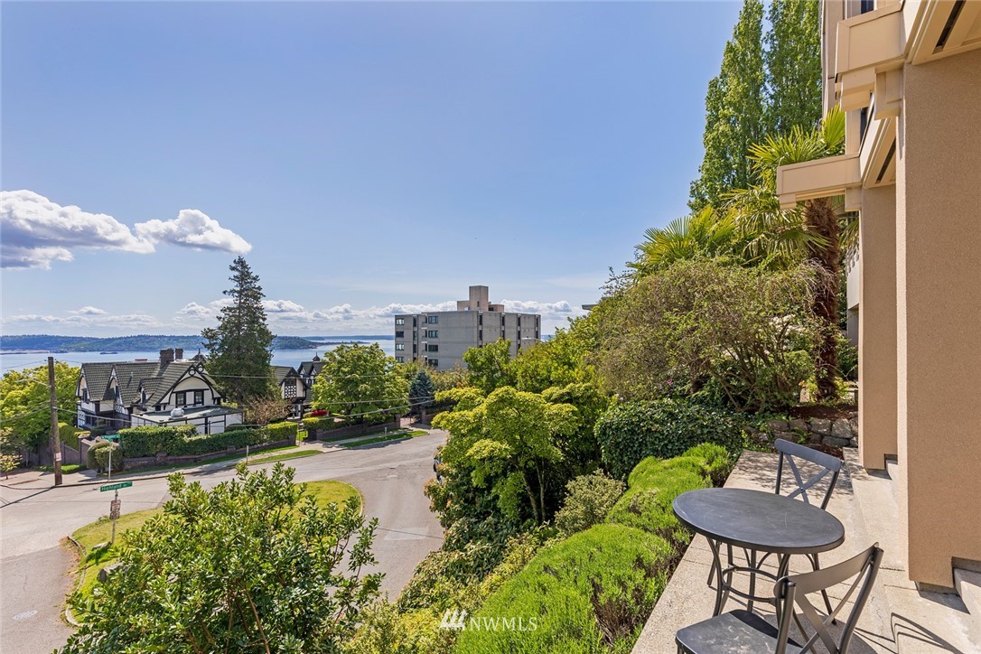 104 Highland Drive Seattle, WA 98109 - Photo 35 of 39 a swimming pool with outdoor seating and plants