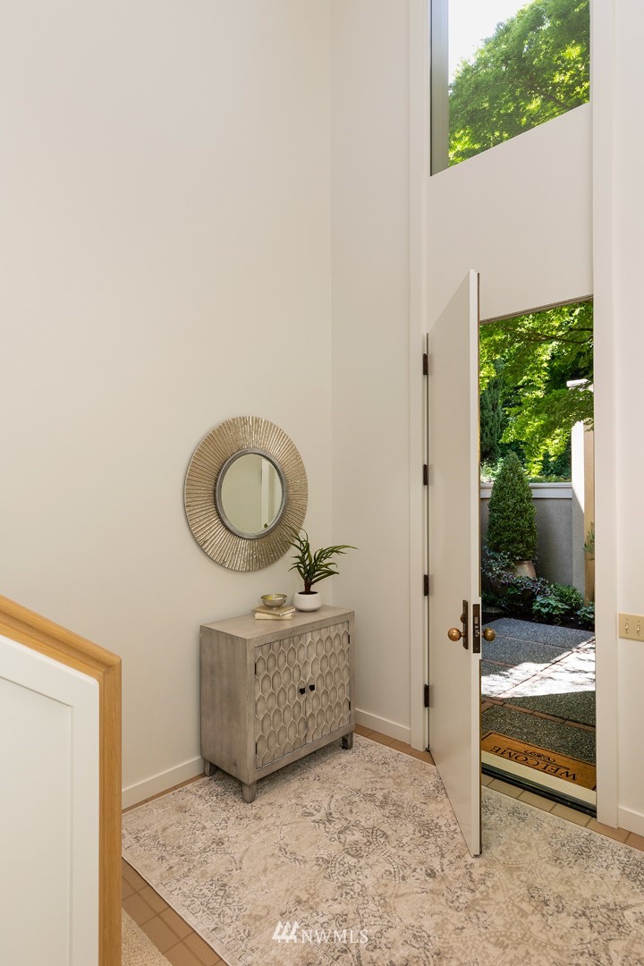 104 Highland Drive Seattle, WA 98109 - Photo 7 of 39 a bathroom with a granite countertop sink and a mirror