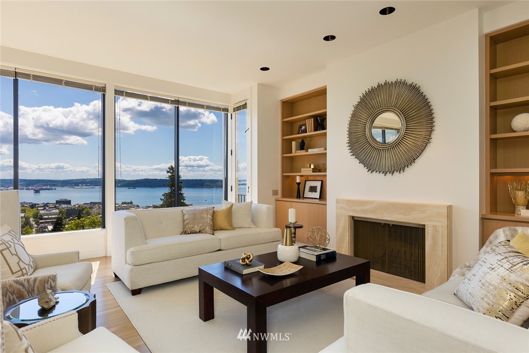 104 Highland Drive Seattle, WA 98109 - Photo 8 of 39 a living room with furniture and a fireplace