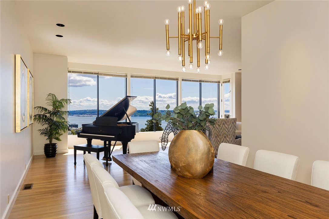 104 Highland Drive Seattle, WA 98109 - Photo 9 of 39 a living room with furniture and a wooden floor