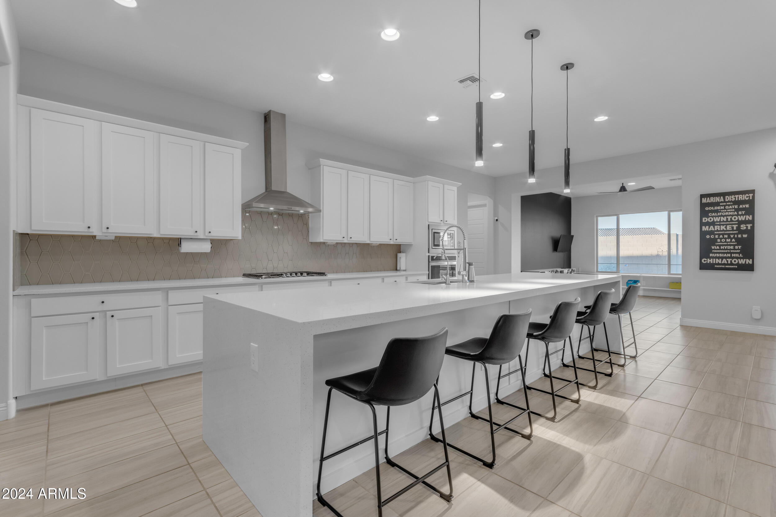 22678 East Stacey Road Queen Creek, AZ 85142 - Photo 24 of 101 a kitchen with kitchen island granite countertop a sink a center island and cabinets