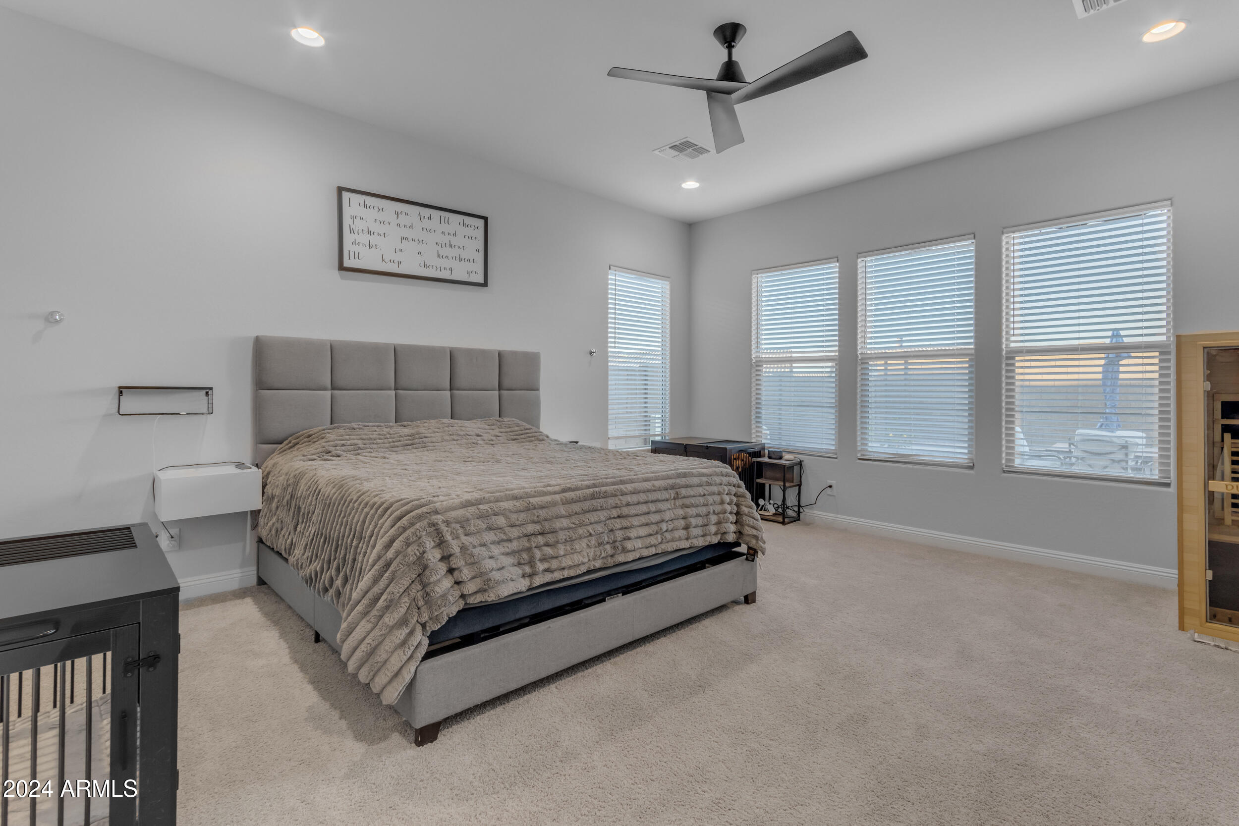 22678 East Stacey Road Queen Creek, AZ 85142 - Photo 33 of 101 a spacious bedroom with a large bed and a large window