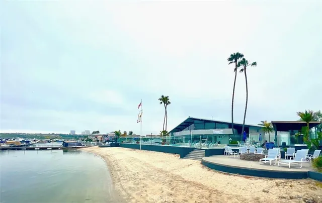 a view of a lake with couches and city view