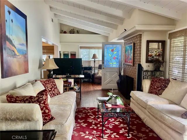 a living room with furniture and a rug