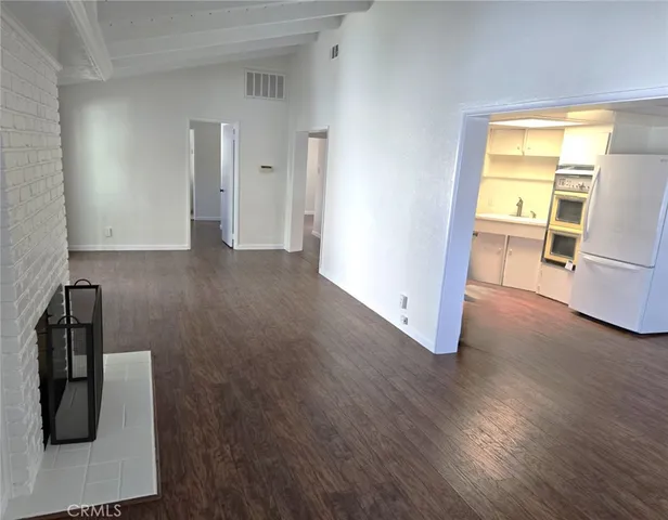 a view of a storage & utility room with empty racks