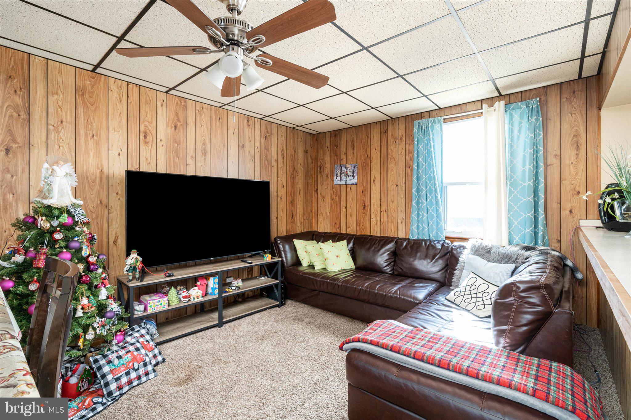 130 North Fairview Street Riverside, NJ 08075 - Photo 22 of 34 a living room with furniture and a flat screen tv