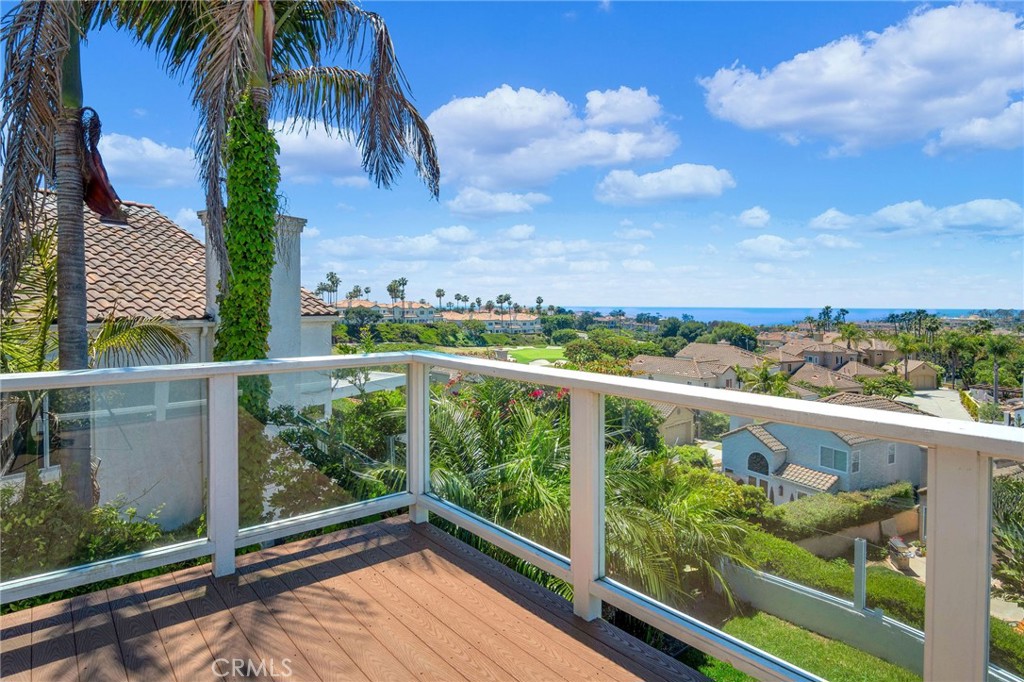 a view of a balcony with wooden fence