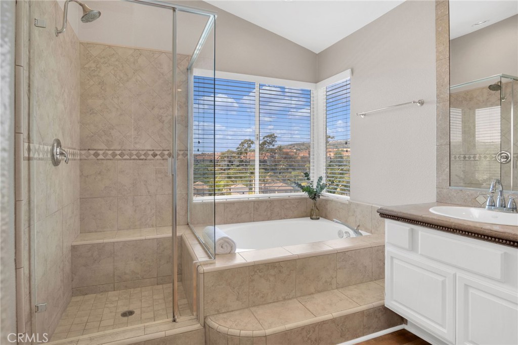 33 Dauphin Dana Point, CA 92629 - Photo 15 of 26 a bathroom with a granite countertop bathtub shower sink and mirror