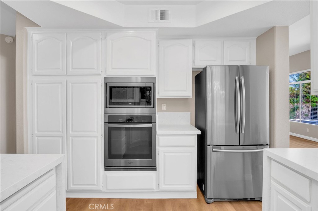 33 Dauphin Dana Point, CA 92629 - Photo 8 of 26 a metallic refrigerator freezer sitting in a kitchen