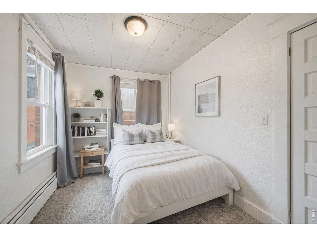 856 10th Street Boulder, CO 80302 - Photo 11 of 28 a bedroom with a large bed and wooden floor