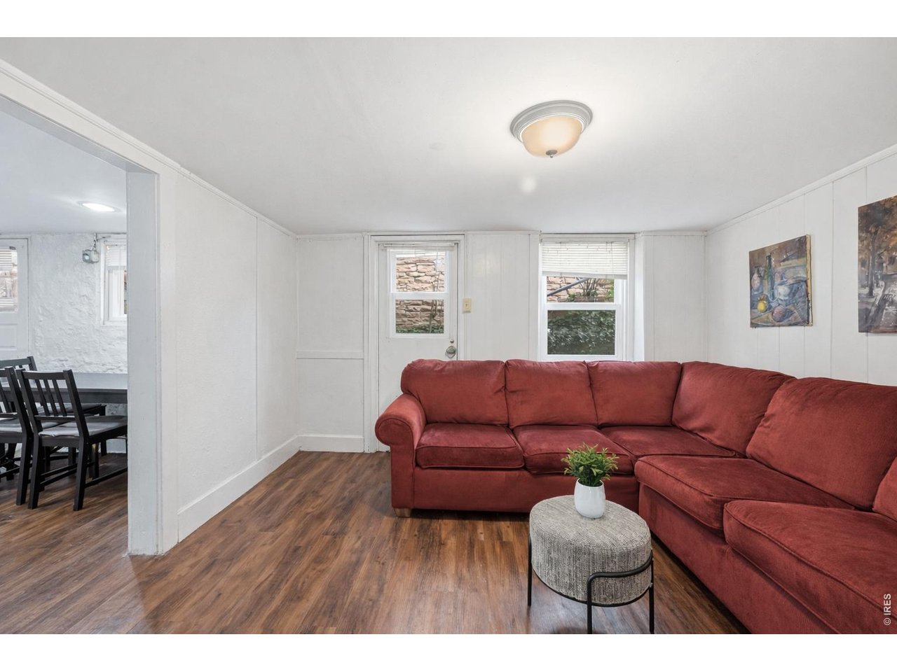 856 10th Street Boulder, CO 80302 - Photo 22 of 28 a living room with furniture a couch and a window
