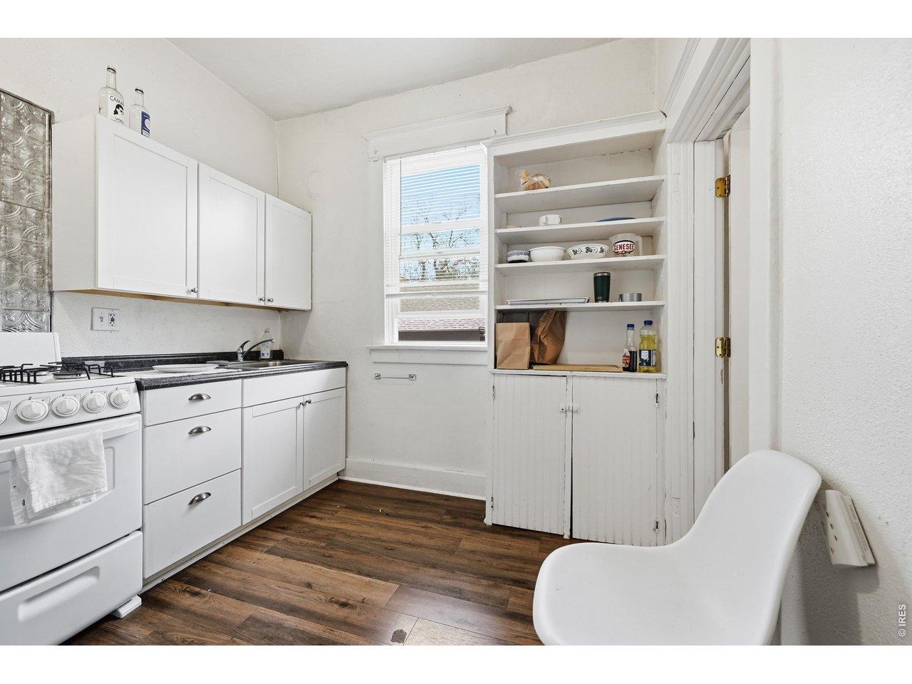856 10th Street Boulder, CO 80302 - Photo 7 of 28 a kitchen with cabinets and window