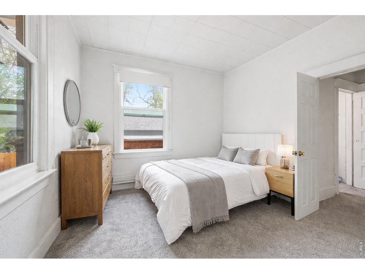 856 10th Street Boulder, CO 80302 - Photo 9 of 28 a bed room with a bed and a window