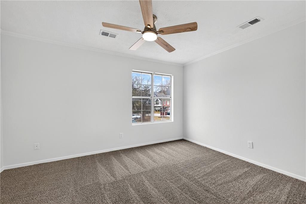 6716 Colchester Place Northwest Norcross, GA 30093 - Photo 13 of 23 a view of an empty room with a window