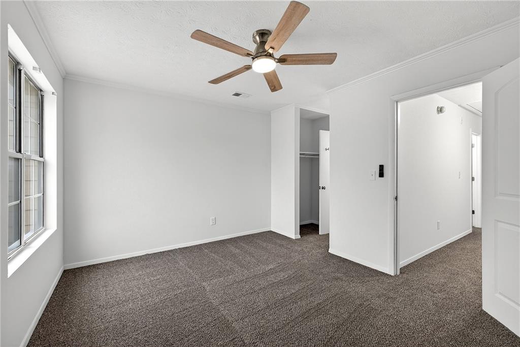 6716 Colchester Place Northwest Norcross, GA 30093 - Photo 14 of 23 a view of an empty room and window