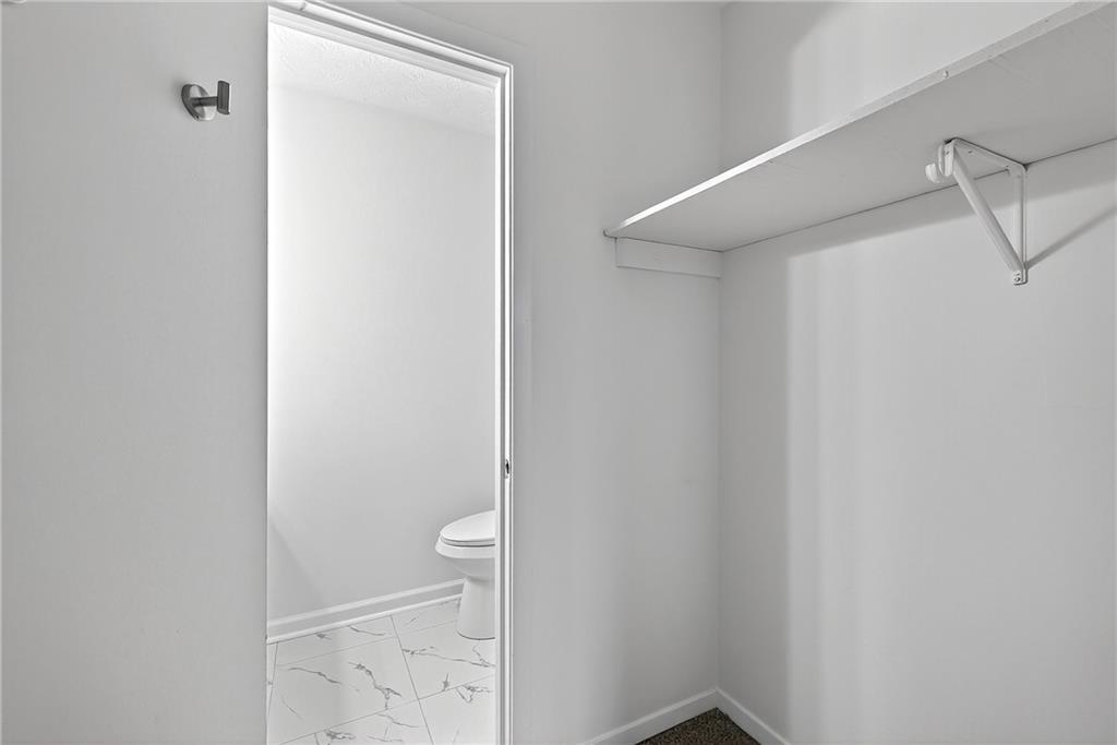 6716 Colchester Place Northwest Norcross, GA 30093 - Photo 15 of 23 a bathroom with a shower