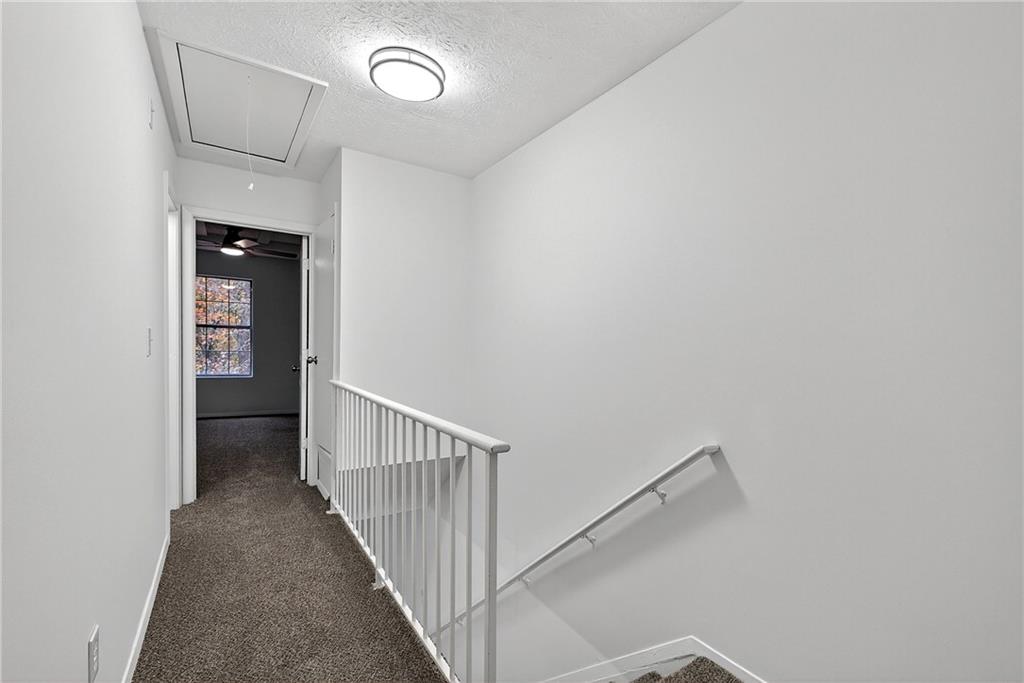 6716 Colchester Place Northwest Norcross, GA 30093 - Photo 17 of 23 a view of a hallway with wooden floor and entryway