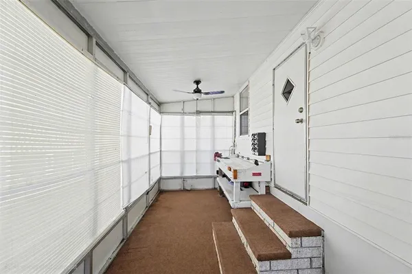 a view of a chairs and table in the patio