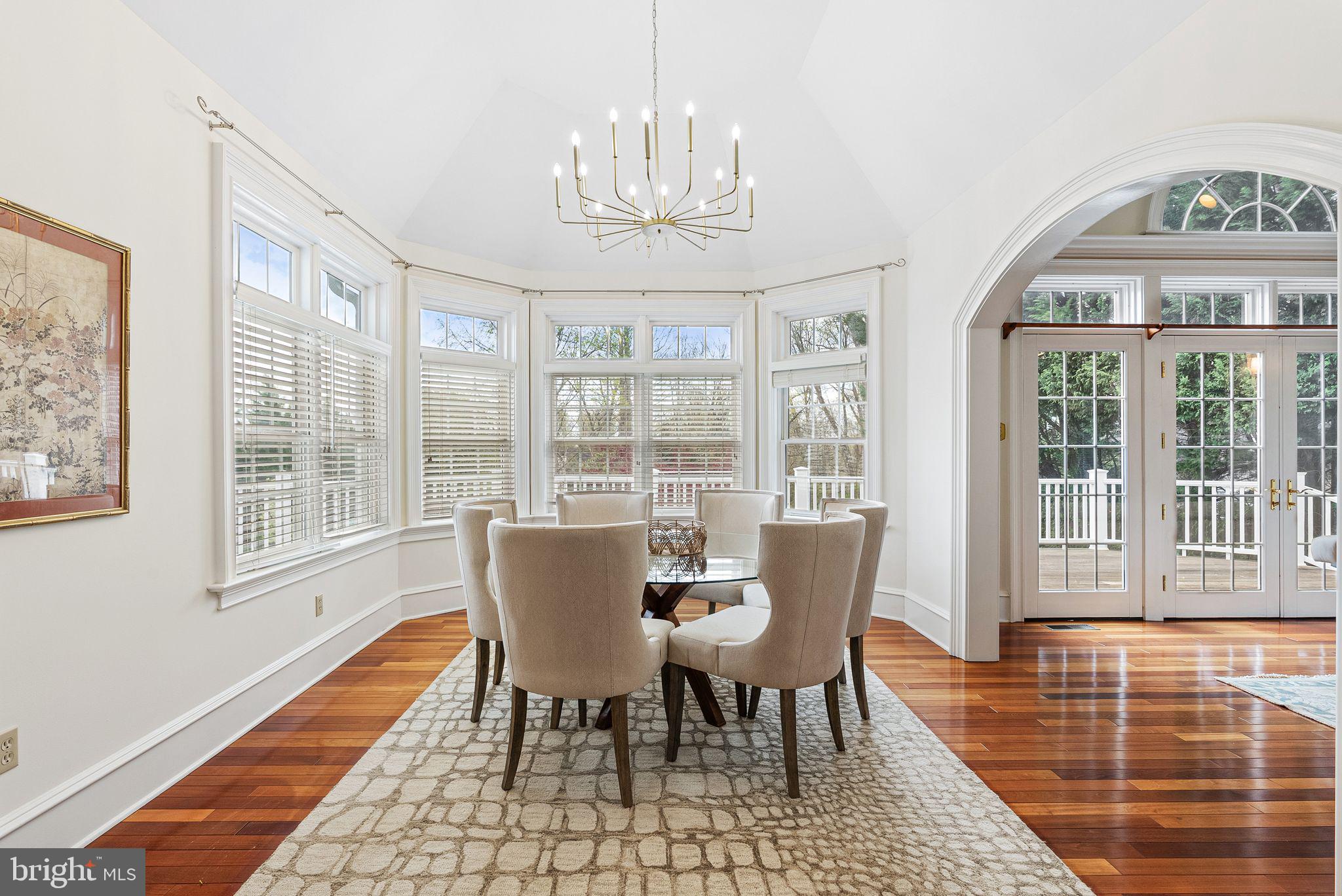 2 Greystone Circle Newtown Square, PA 19073 - Photo 11 of 57 a view of a dining room with furniture a chandelier and wooden floor