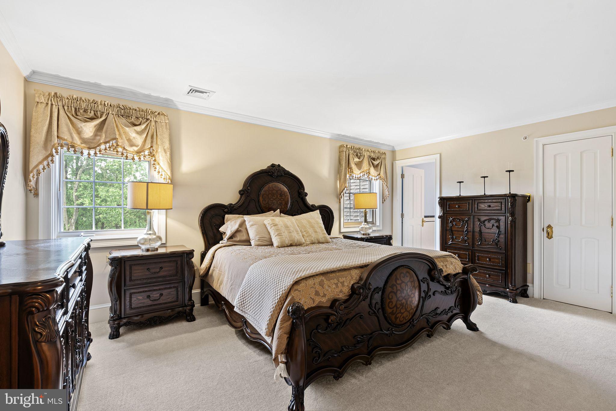 2 Greystone Circle Newtown Square, PA 19073 - Photo 26 of 57 a bedroom with a bed and a dresser next to a window