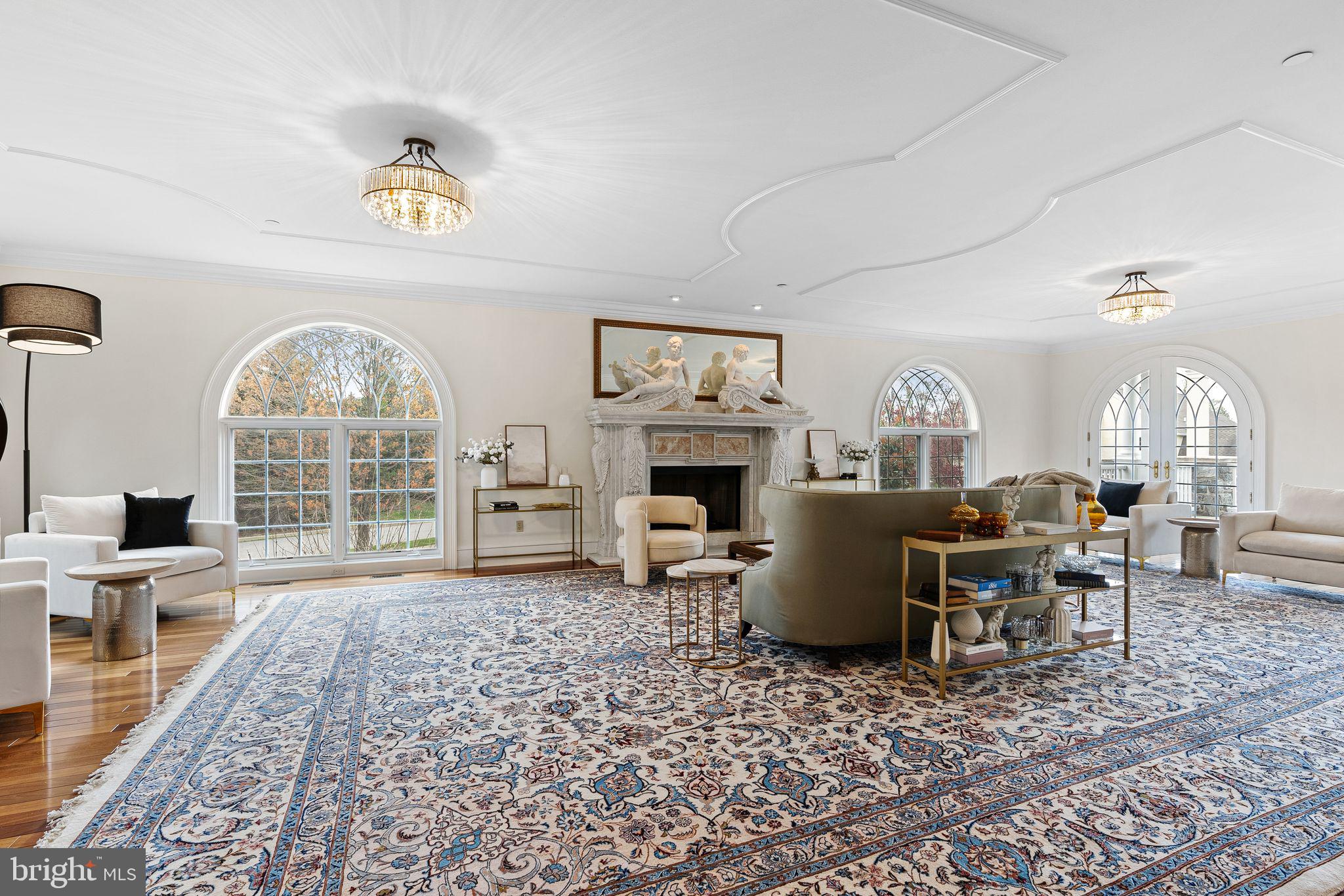 2 Greystone Circle Newtown Square, PA 19073 - Photo 4 of 57 a living room with furniture a fireplace and a table