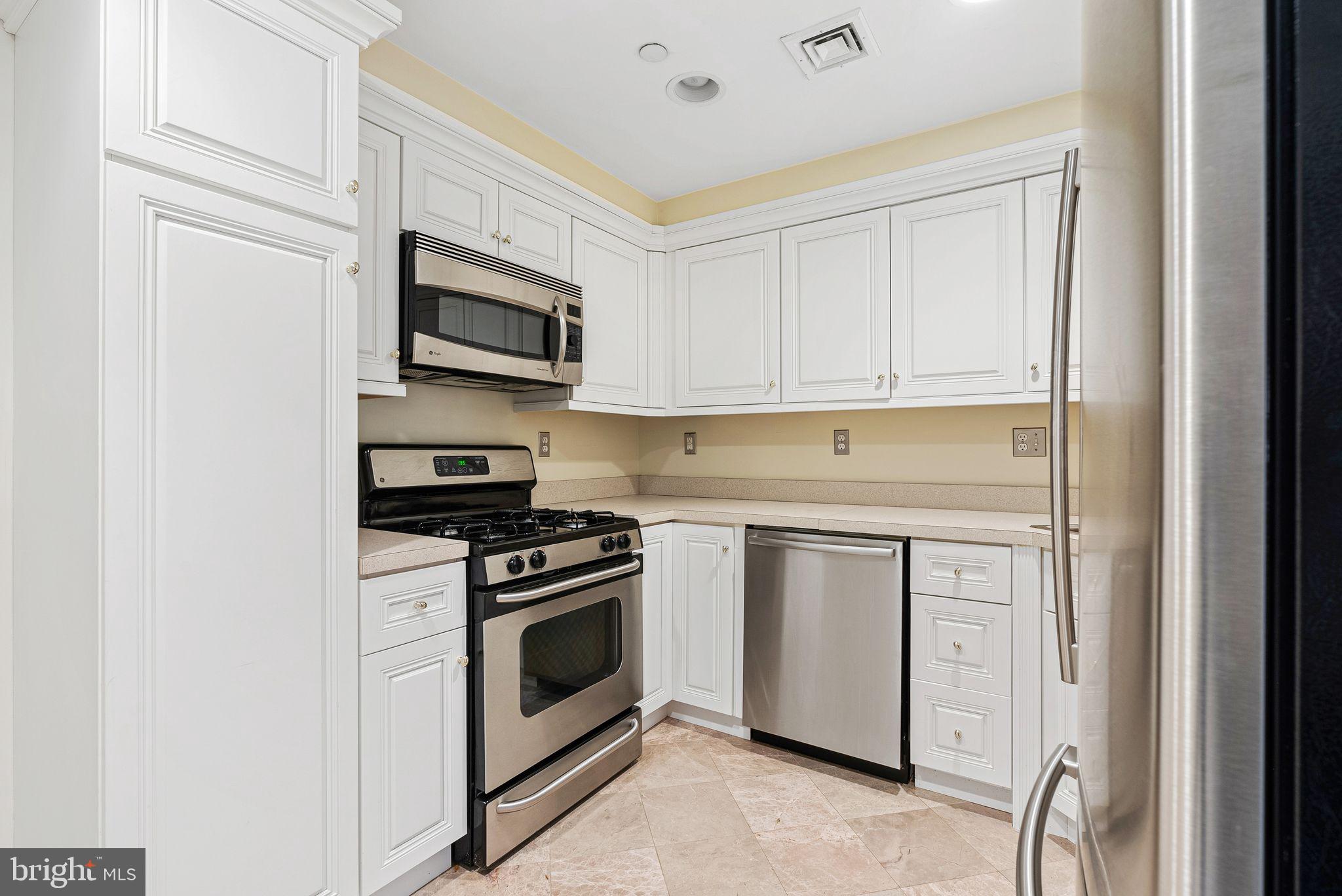 2 Greystone Circle Newtown Square, PA 19073 - Photo 46 of 57 a kitchen with stainless steel appliances granite countertop white cabinets a stove top oven