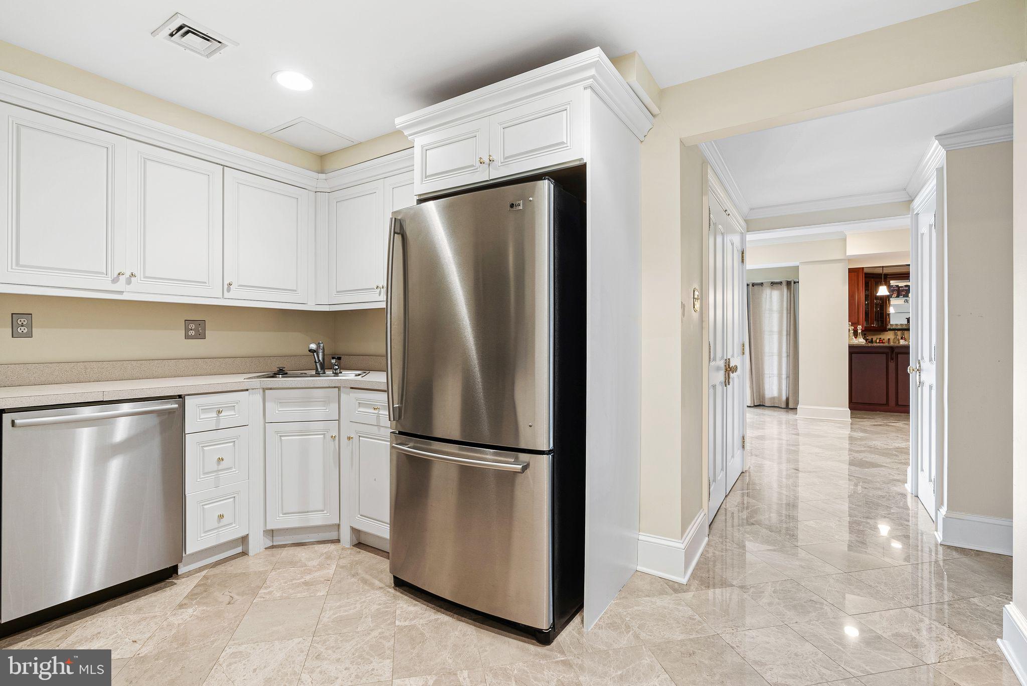 2 Greystone Circle Newtown Square, PA 19073 - Photo 47 of 57 a kitchen with stainless steel appliances granite countertop a refrigerator sink and cabinets