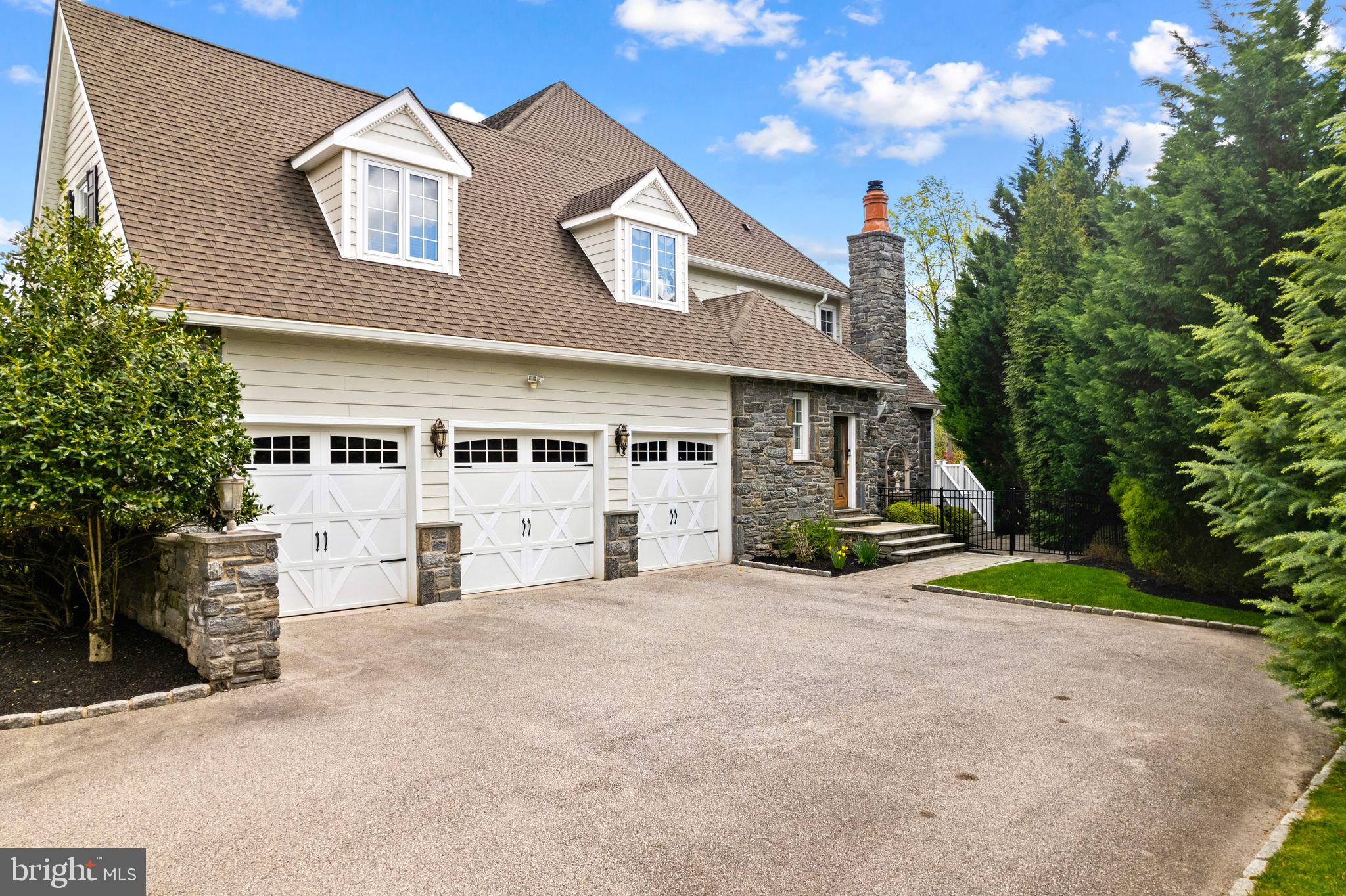 2 Greystone Circle Newtown Square, PA 19073 - Photo 48 of 57 a front view of a house with a yard and garage