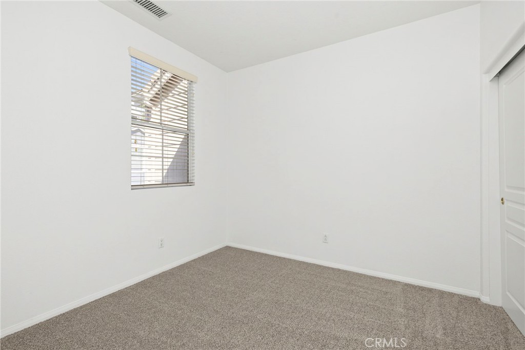 4 Toribeth Street, Unit 8 Ladera Ranch, CA 92694 - Photo 11 of 26 2nd guest bedroom with new carpet.