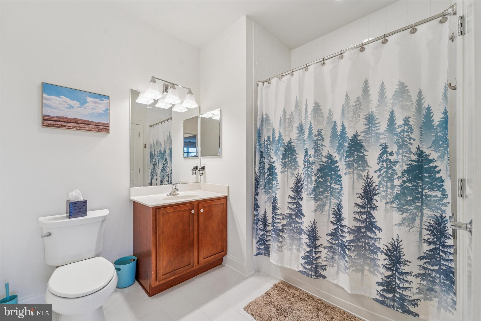 2346 Highway 33, Unit 302 Robbinsville, NJ 08691 - Photo 14 of 21 a view of bathroom with a toilet sink and mirror
