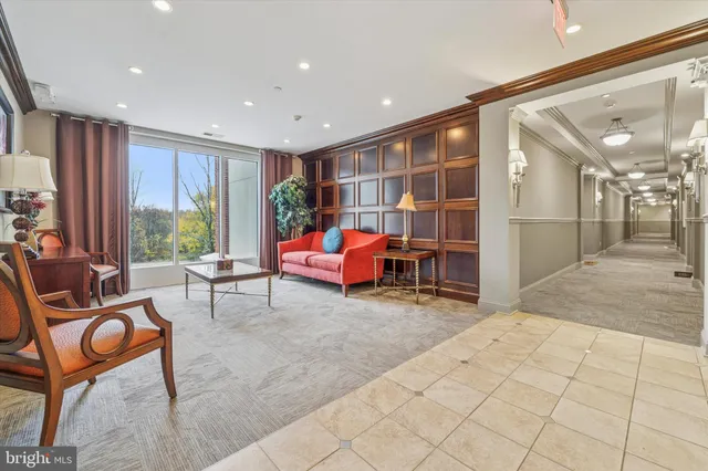 a room with furniture and a large window