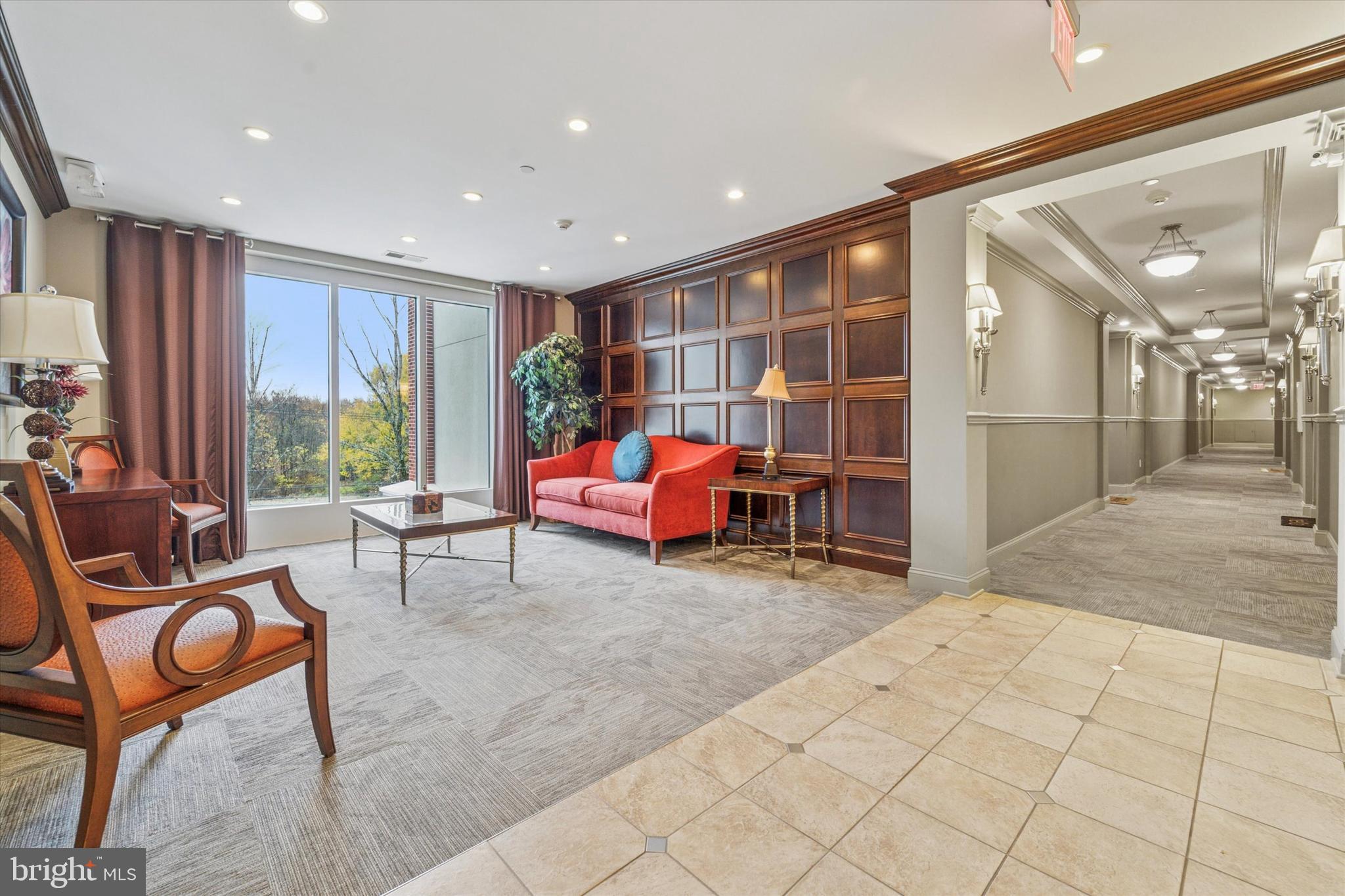 2346 Highway 33, Unit 302 Robbinsville, NJ 08691 - Photo 3 of 21 a room with furniture and a large window