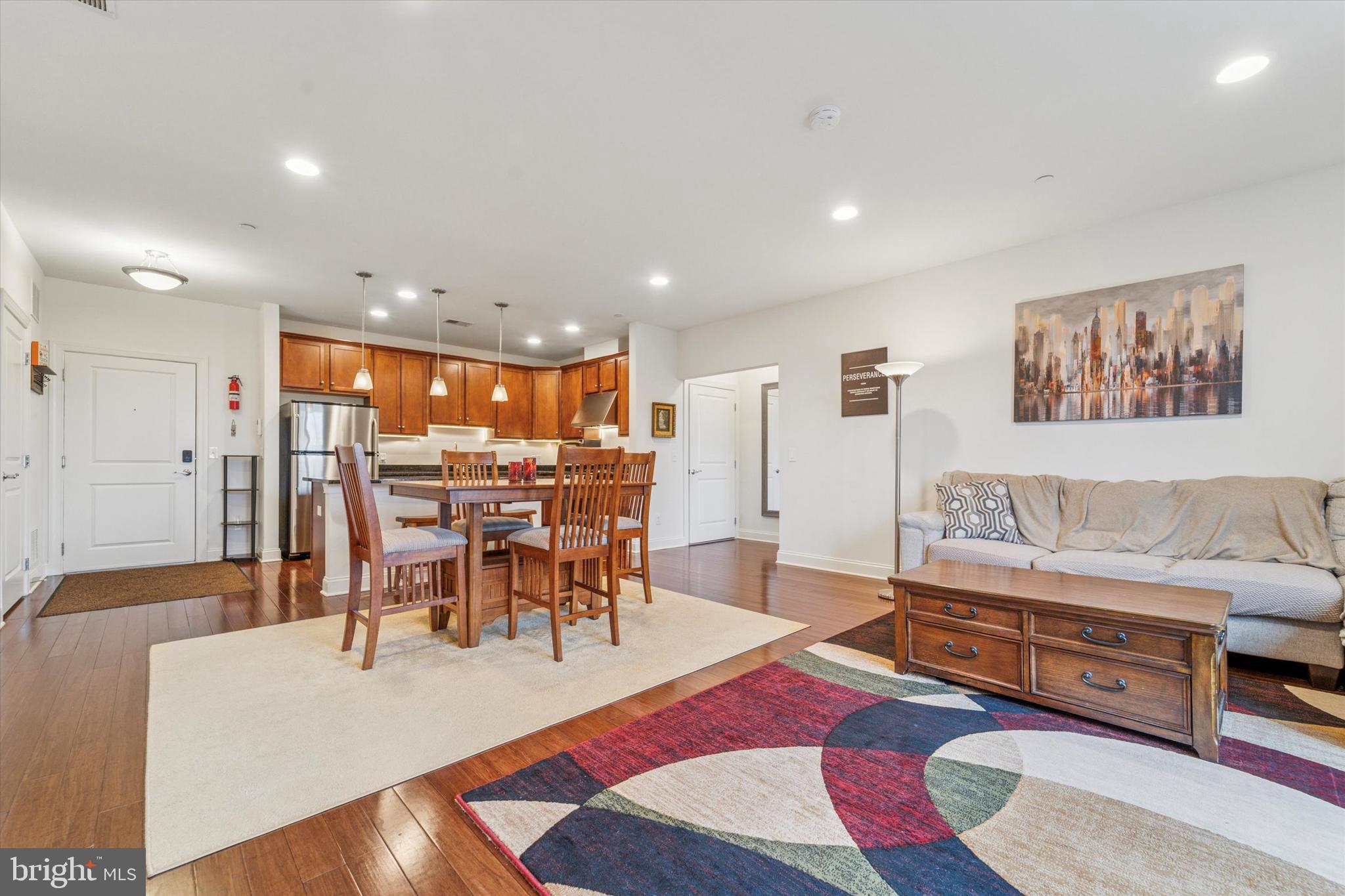 2346 Highway 33, Unit 302 Robbinsville, NJ 08691 - Photo 5 of 21 a living room with furniture and wooden floor