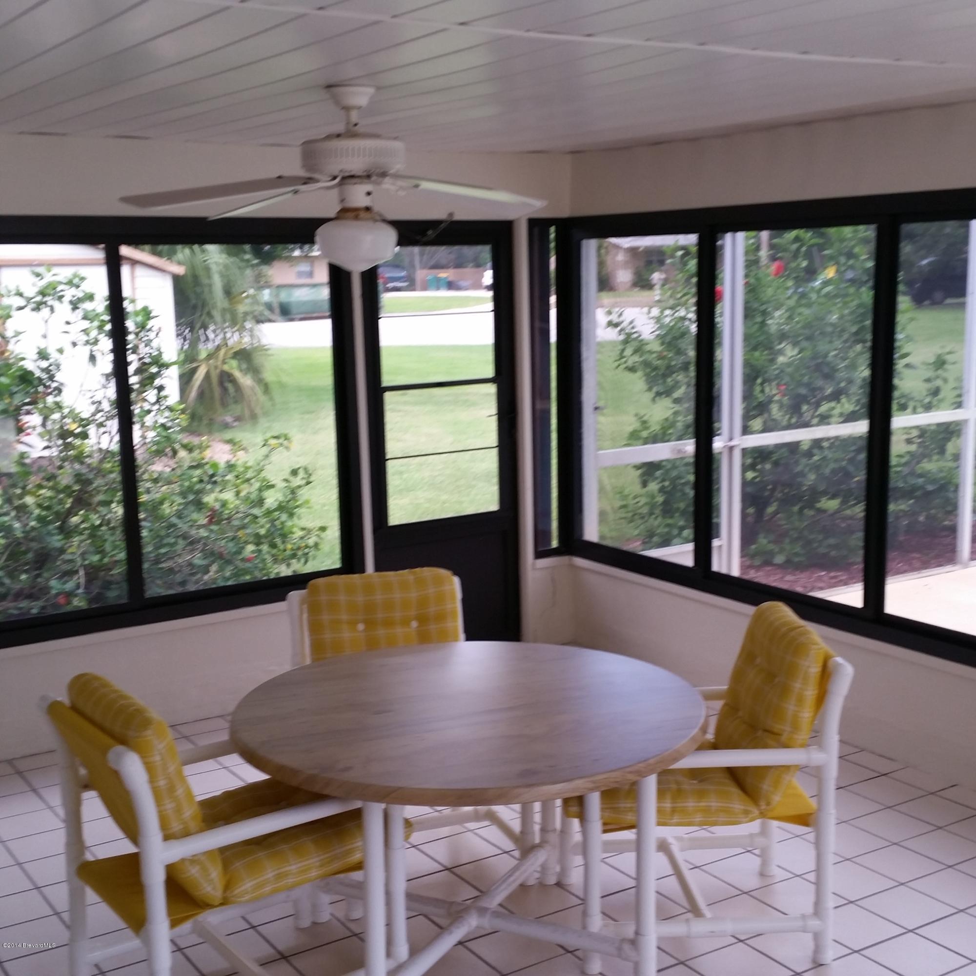 500 Plantation Road Merritt Island, FL 32952 - Photo 21 of 35 Florida Room w/ windows overlooking pool