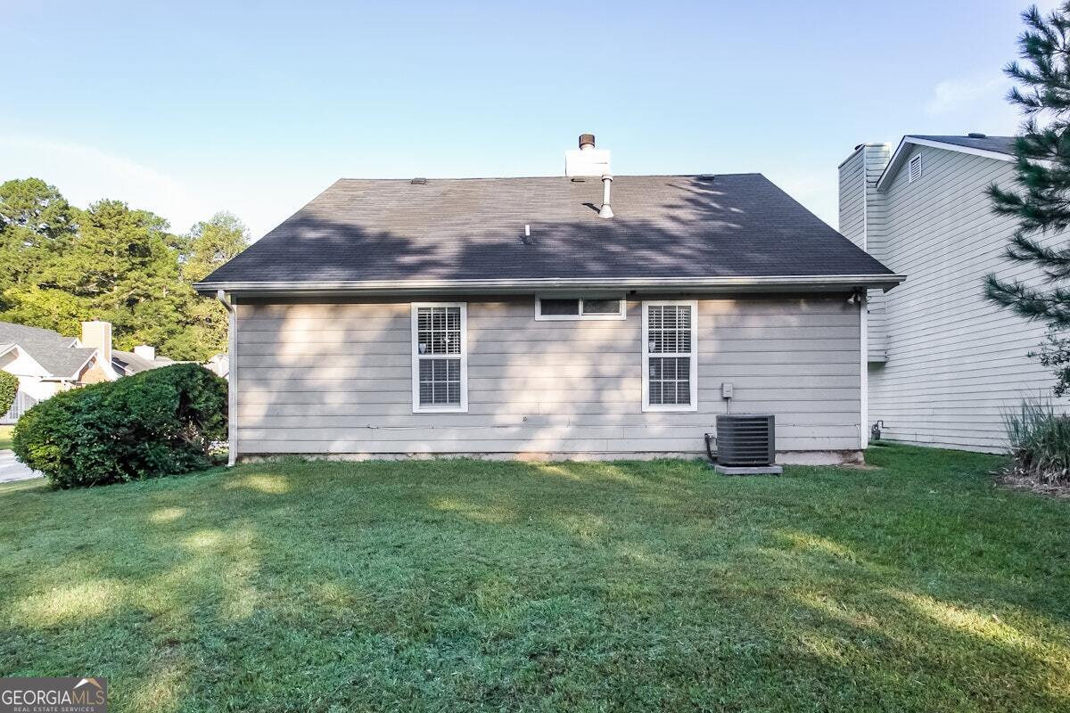 1136 Oakwood Manor Court Decatur, GA 30032 - Photo 15 of 15 a front view of a house with a yard