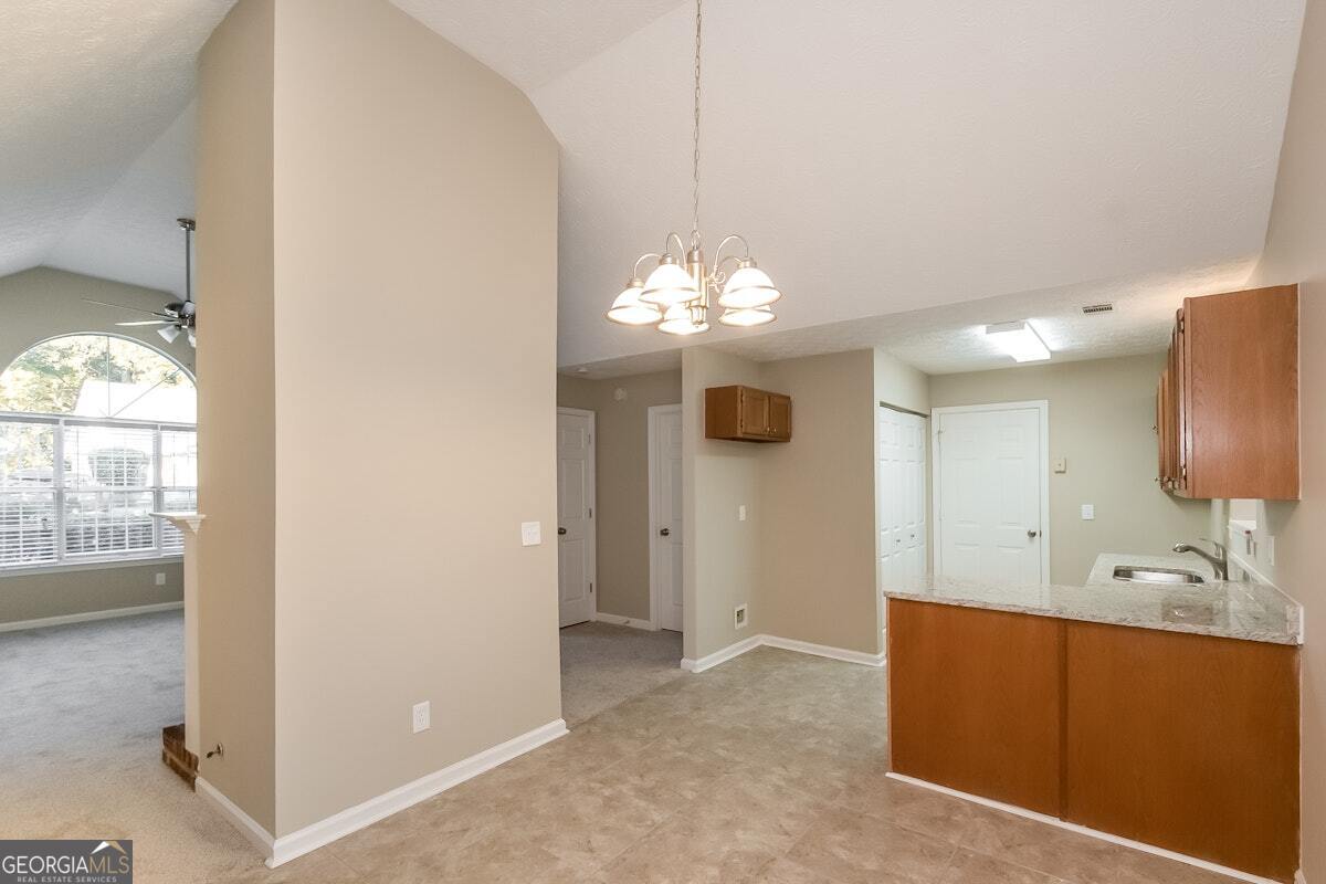 1136 Oakwood Manor Court Decatur, GA 30032 - Photo 3 of 15 a bathroom with a sink a light fixture and a mirror