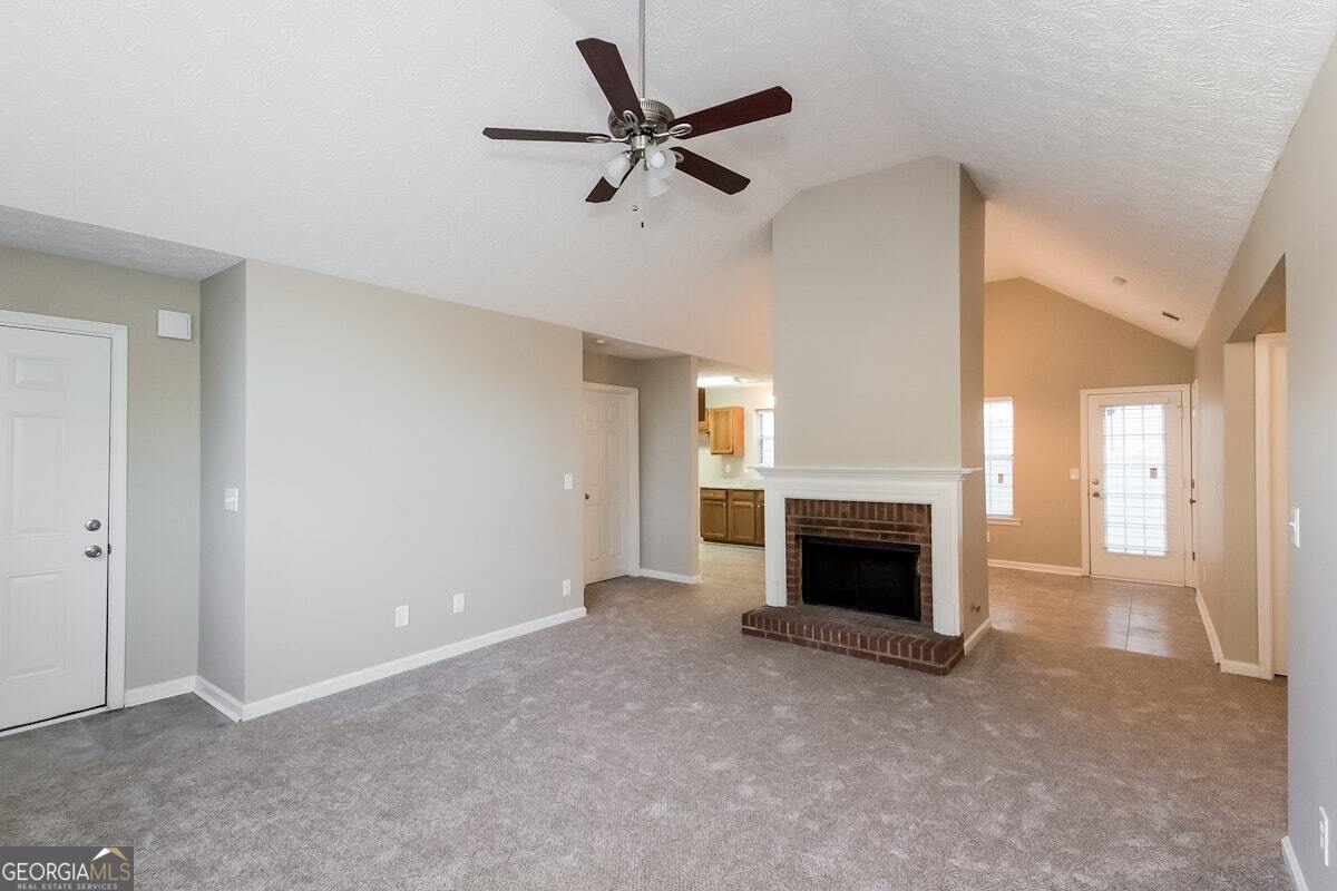 1136 Oakwood Manor Court Decatur, GA 30032 - Photo 5 of 15 a living room with furniture and a fireplace