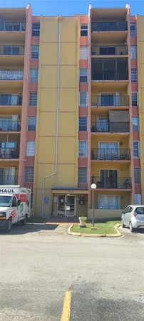 a front view of a building with street view