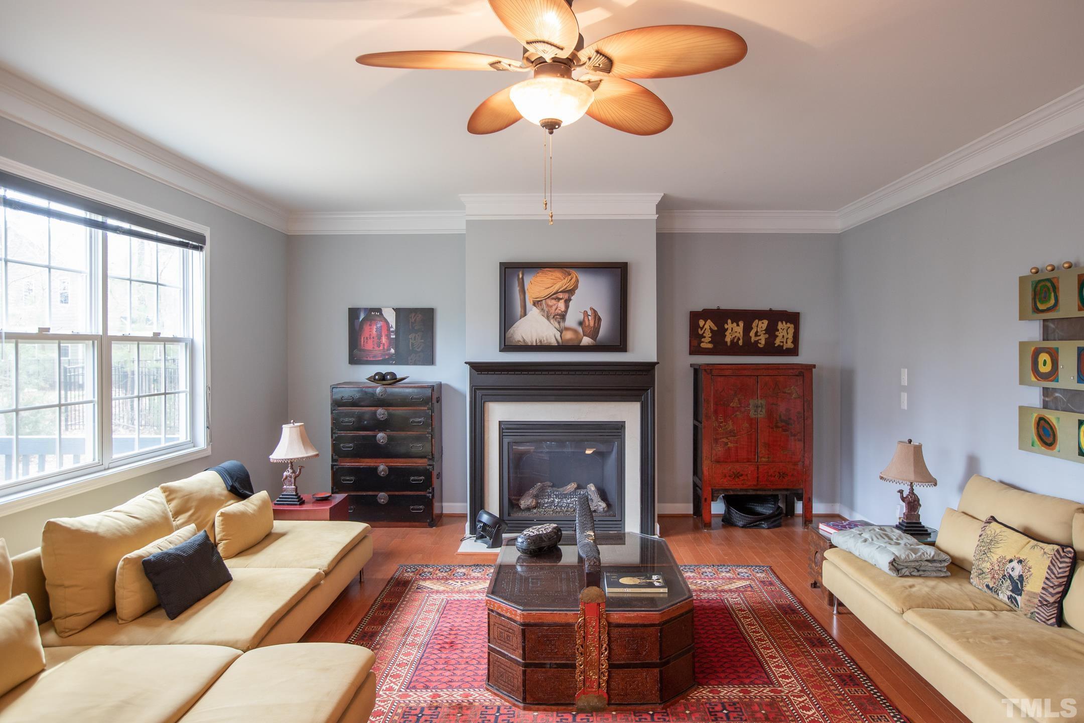110 Few Circle Durham, NC 27705 - Photo 22 of 49 a living room with furniture a fireplace and a large window