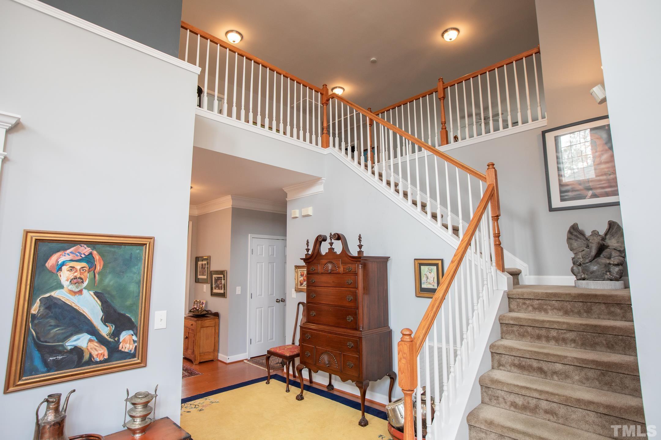 110 Few Circle Durham, NC 27705 - Photo 9 of 49 a view of a hallway with wooden floor and stairs