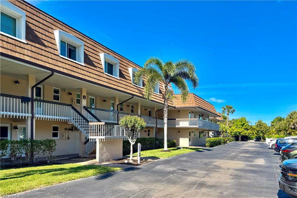 87 North Collier Boulevard, Unit J18 Marco Island, FL 34145 - Photo 14 of 21 BBQ area in distance