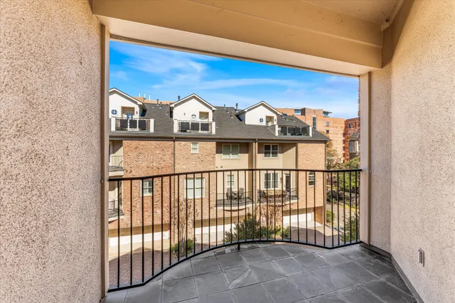 a view of a balcony with two chairs
